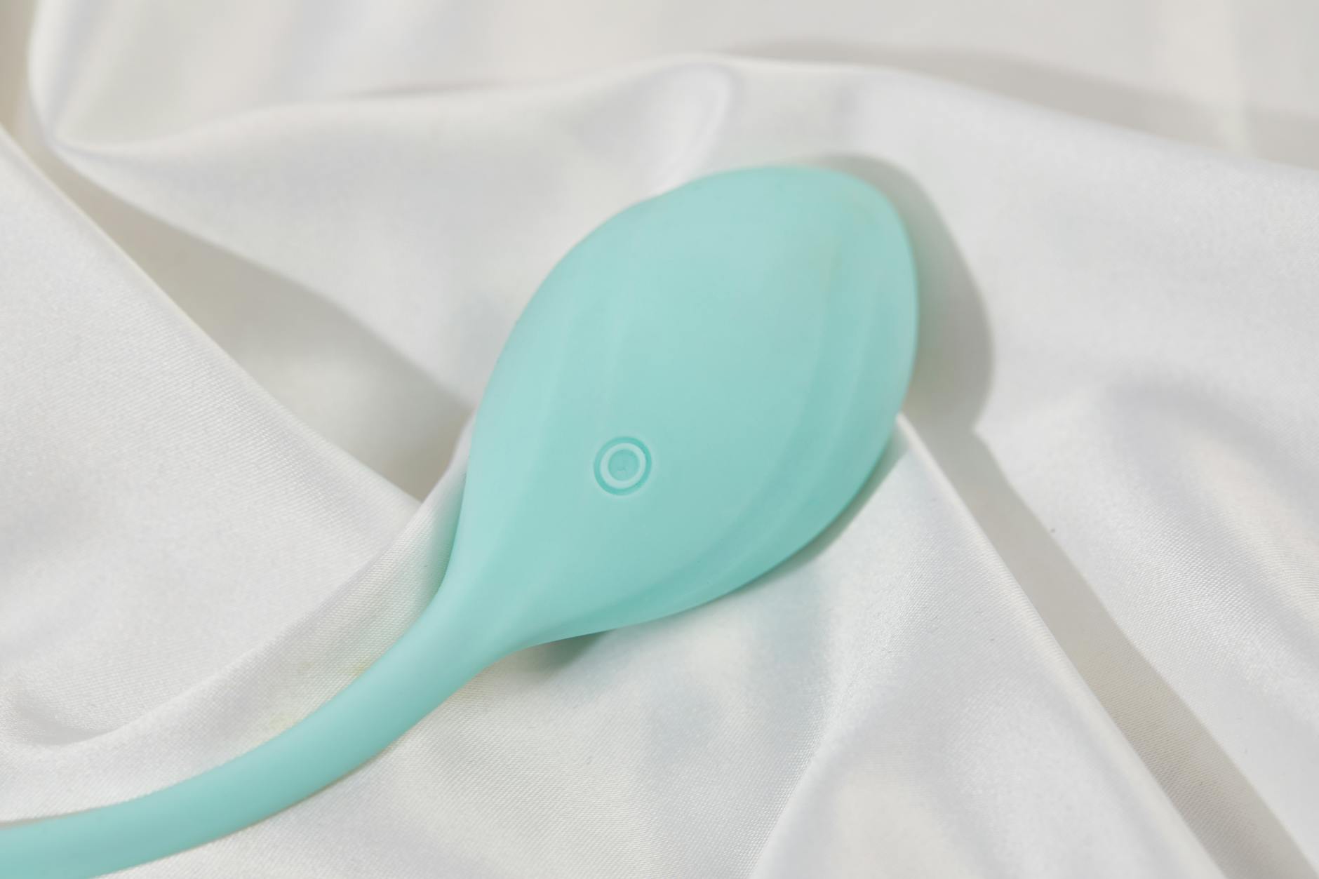 Bright yellow lemons arranged on a pastel green background, symbolizing the gentle approach of Hello Nancy lemon vibrators